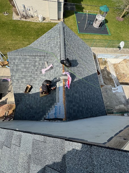 Drone view of roof replacement project in progress for a residential home in Michiana